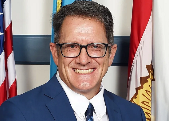 profile image of Robert Bryant in front of patriotic flags
